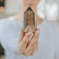 Justicia Healing holding smoky quartz for crystal healing