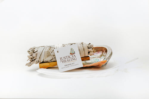 Smudge Kit with ethically sourced white sage, palo santo, a white feather and an abalone shell dish
