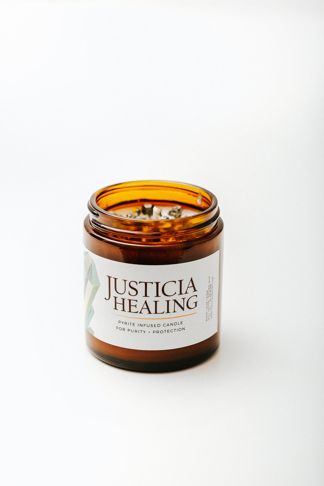 Justicia Healing Pyrite crystal infused candle